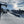 Ski lift at Tussey Mountain Ski Area with skiers on a snowy slope under a partly cloudy sky - photo by Purple Lizard Maps