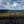 Pink bicycle on a dirt path with a scenic view of rolling hills and blue sky in Rothrock State Forest - photo by Purple Lizard Maps