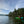 Person kayaking on Colyer Lake PA a lake with trees and mountains in the background on the Purple Lizard Map